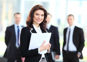 Face of beautiful woman on the background of business people